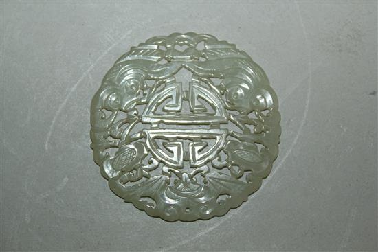 A Chinese pale celadon jade disc, 19th century, 5.3cm